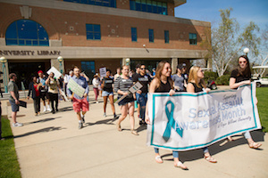 students walking for sexual violence awareness